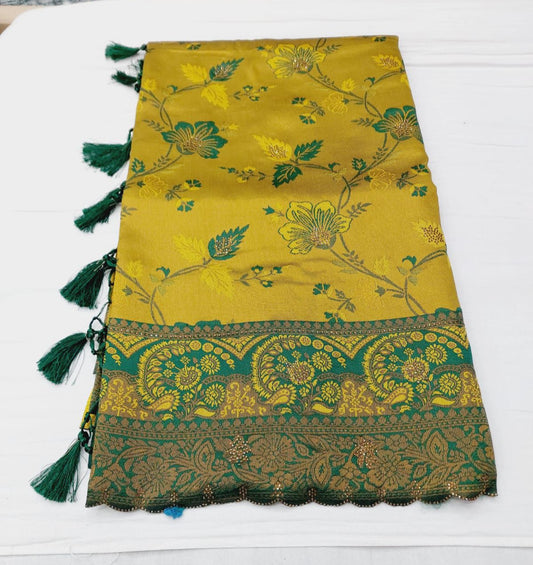 "Elegant Golden Floral Saree with Green Border and Tassels"